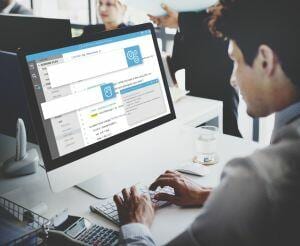 SEO Company employee on computer working with the best SEO tools. 