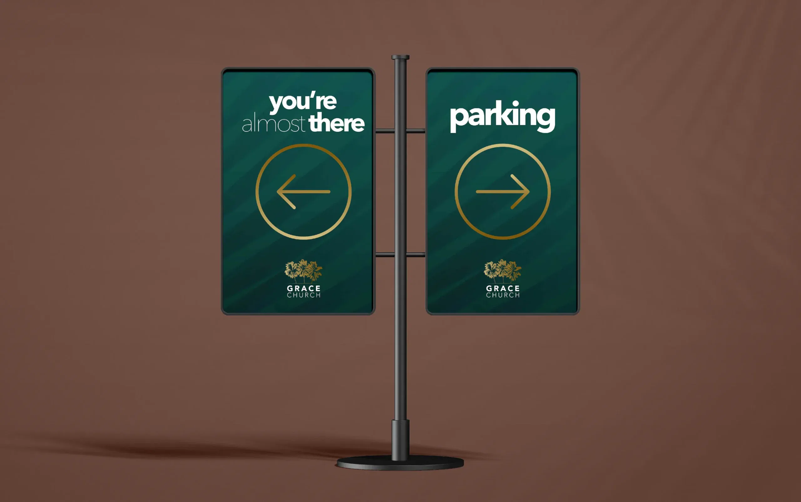 Directional sign with arrows and text guiding towards parking on a sleek, green background.