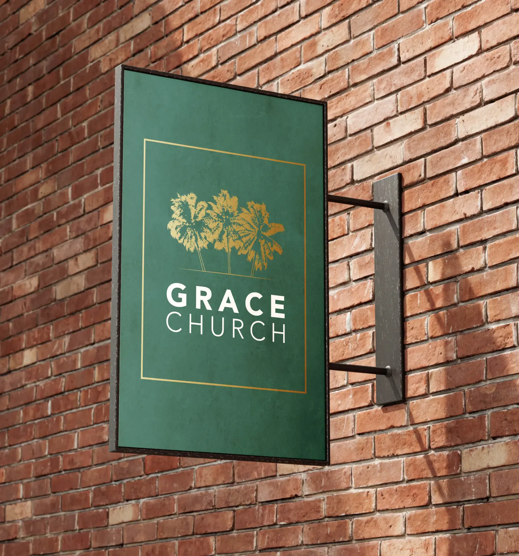 Rectangular sign for Grace Church with floral design on a brick wall