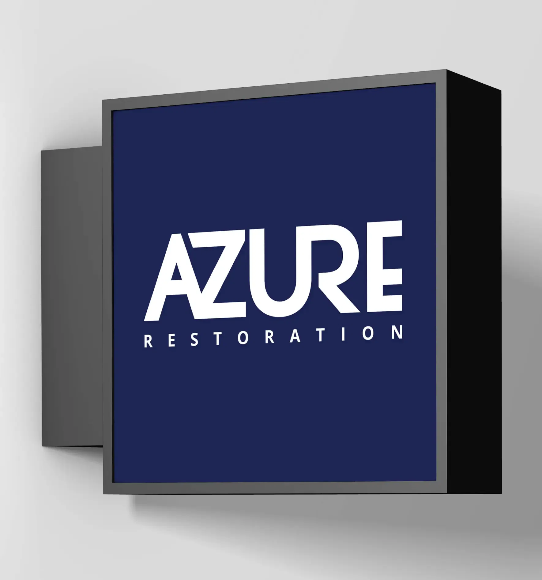 Azure Restoration logo on a sleek wall-mounted sign with a modern design.