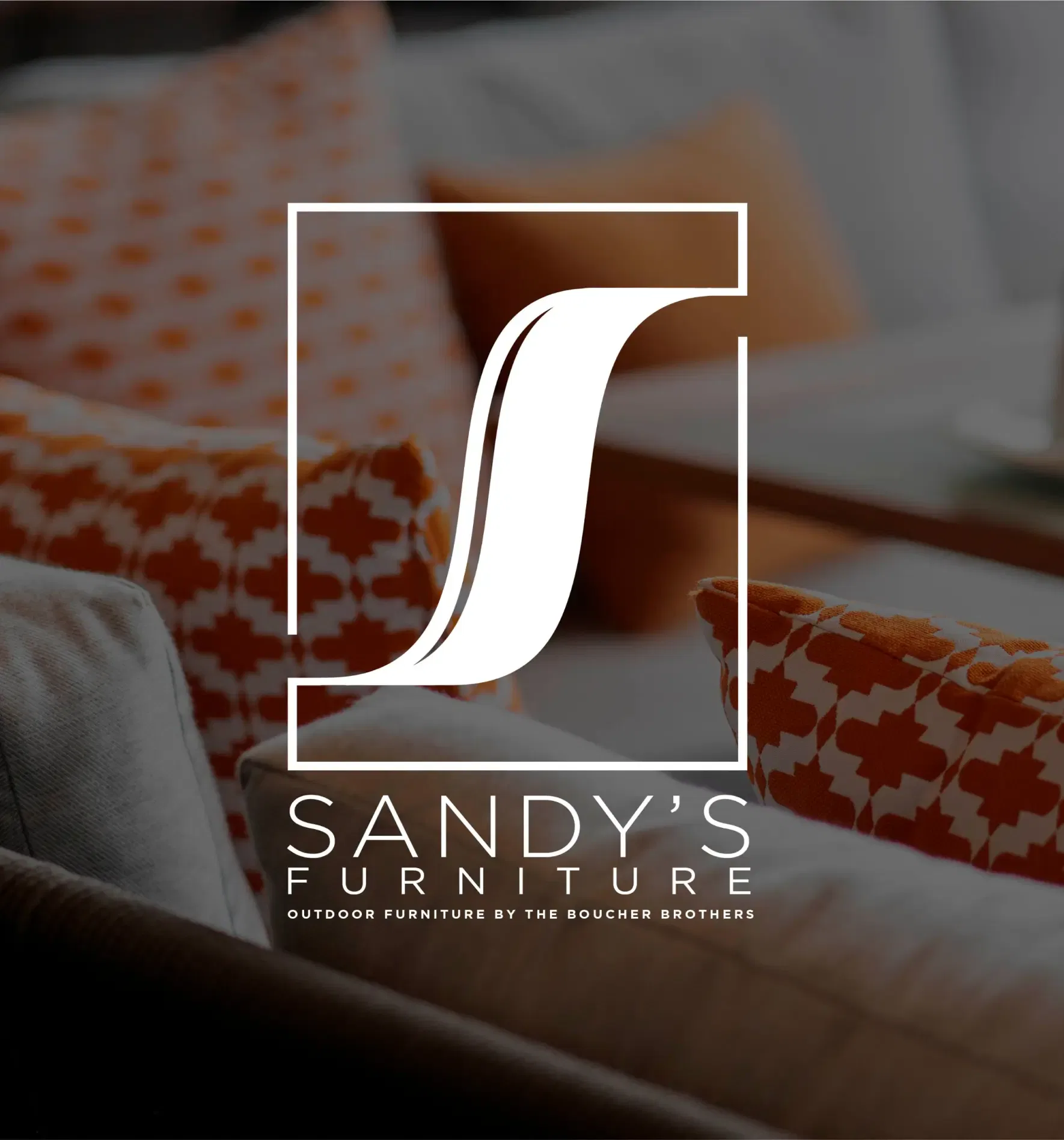 Sandy's Furniture logo with stylish orange and white sofa cushions in the background.
