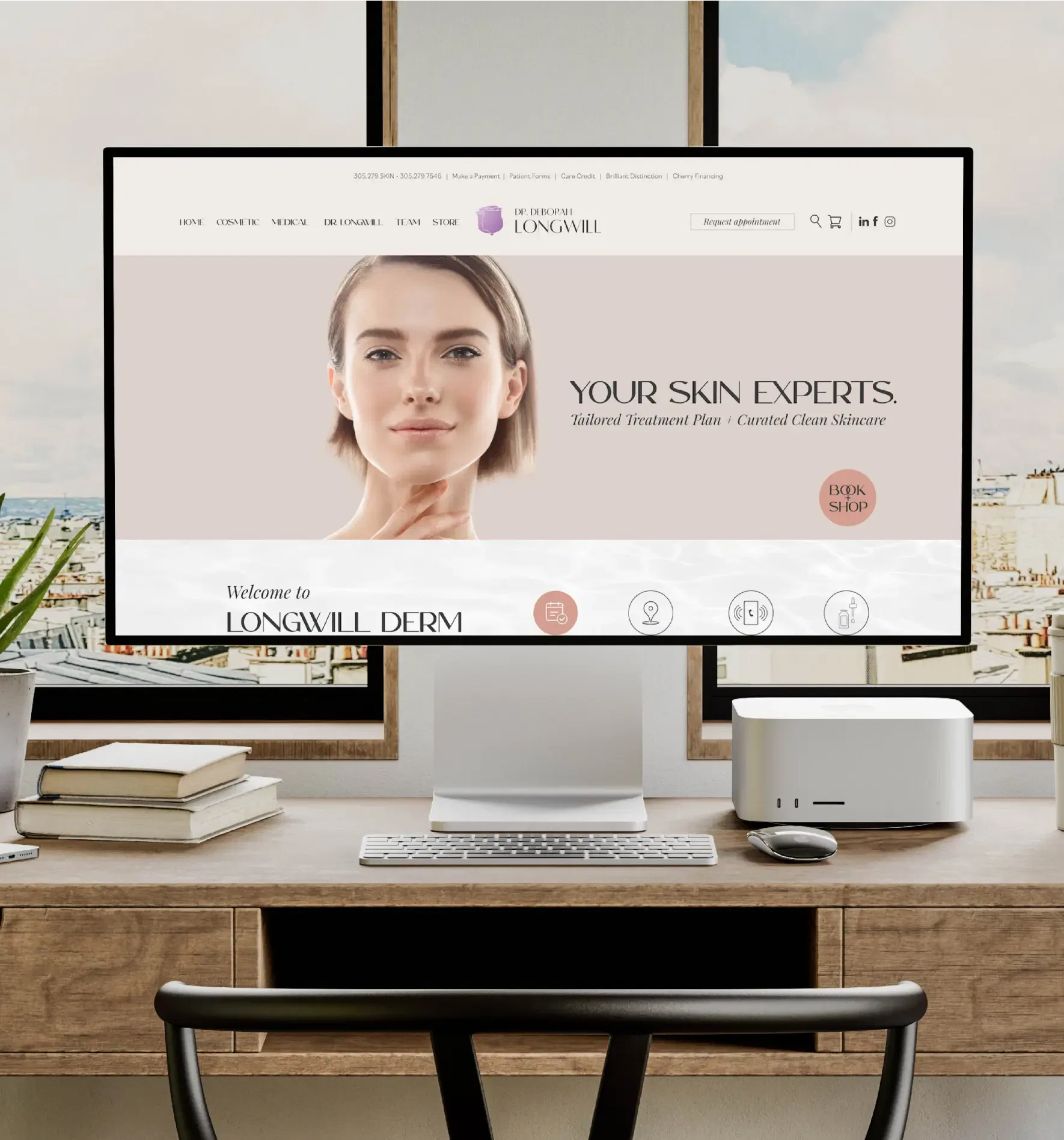 A sleek computer setup displaying a skincare website, set on a modern desk with a city view.