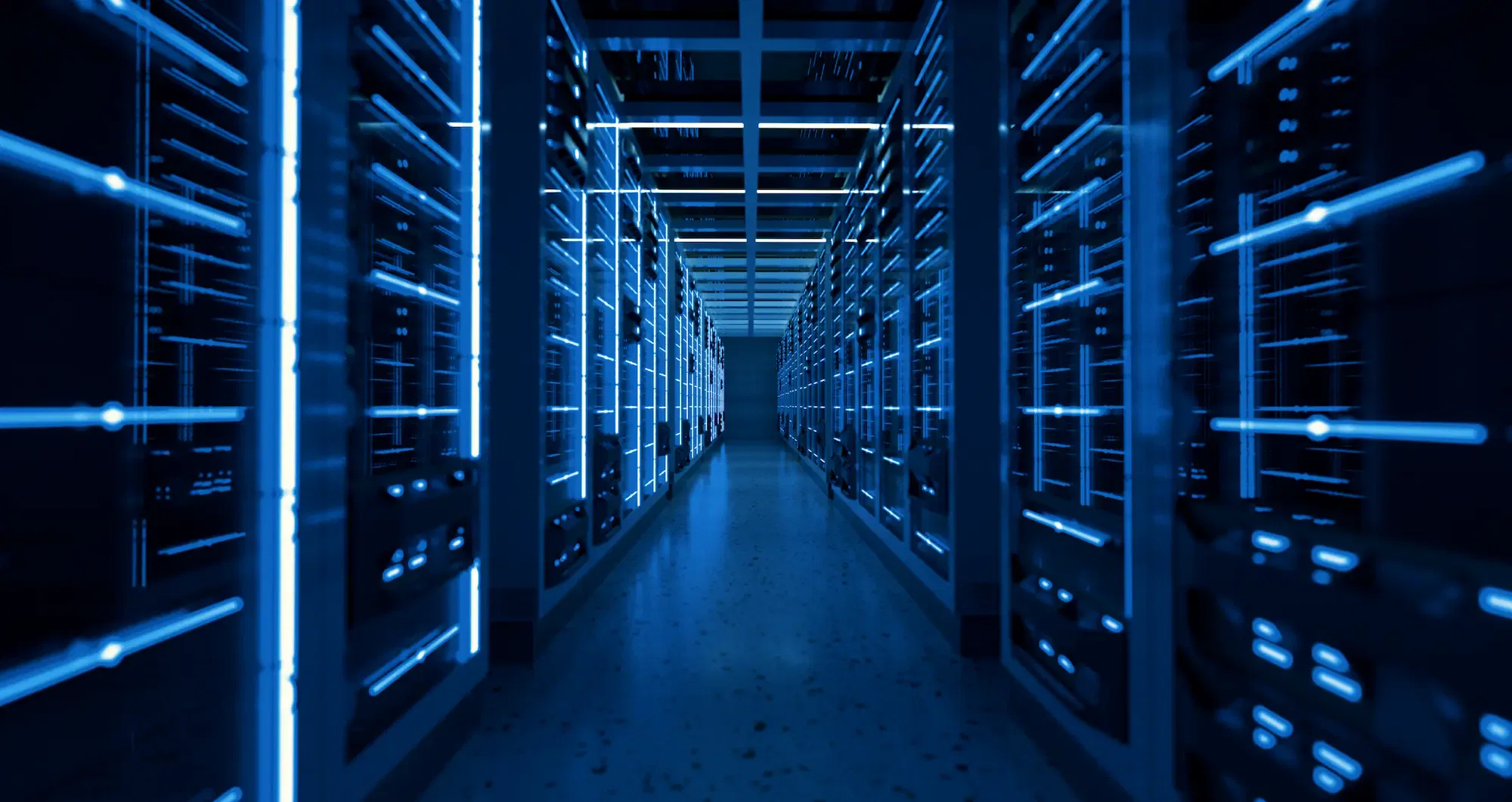 Modern data center with illuminated blue server racks in a long hallway.