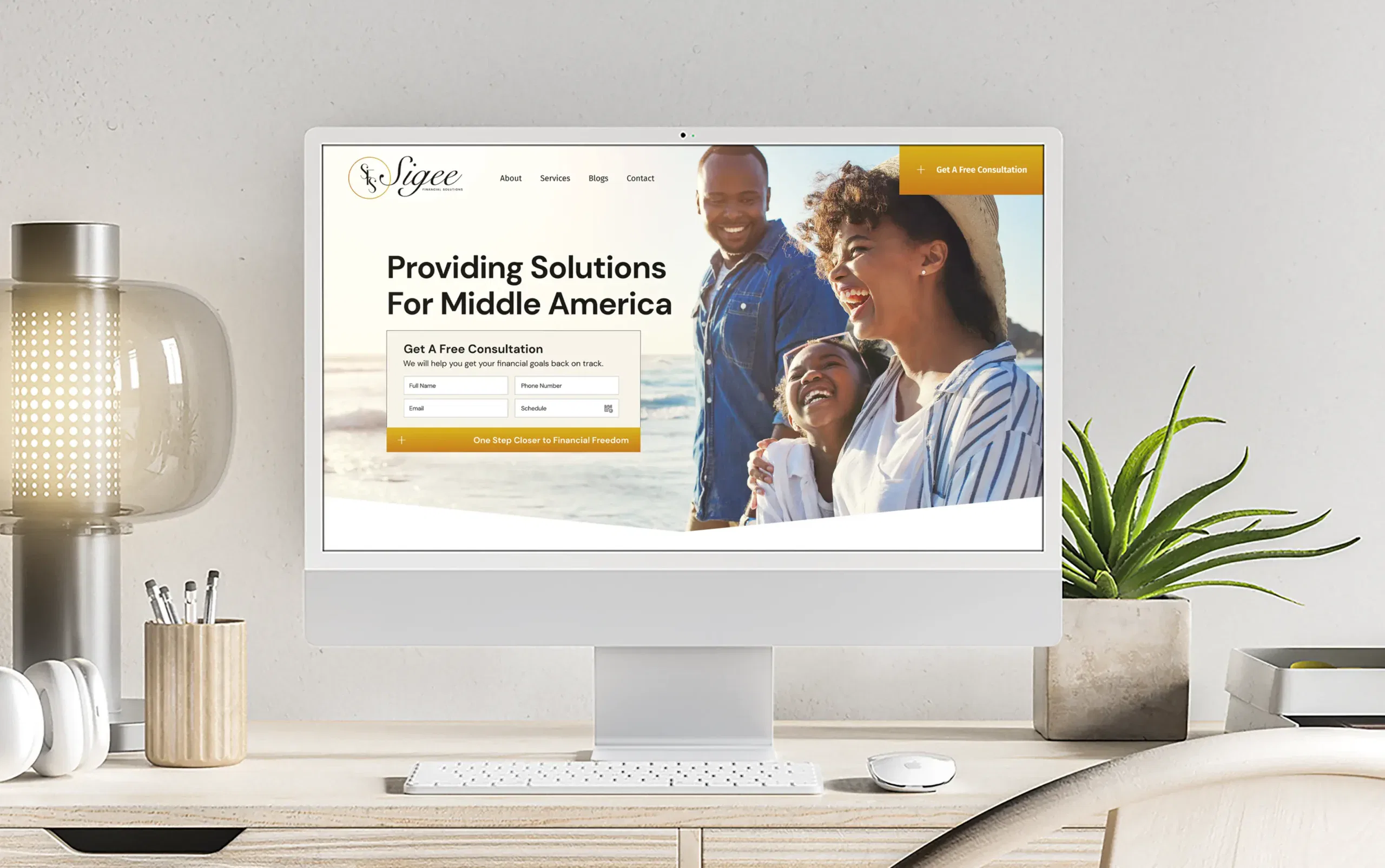 Modern desk setup with computer displaying a website offering solutions for Middle America.