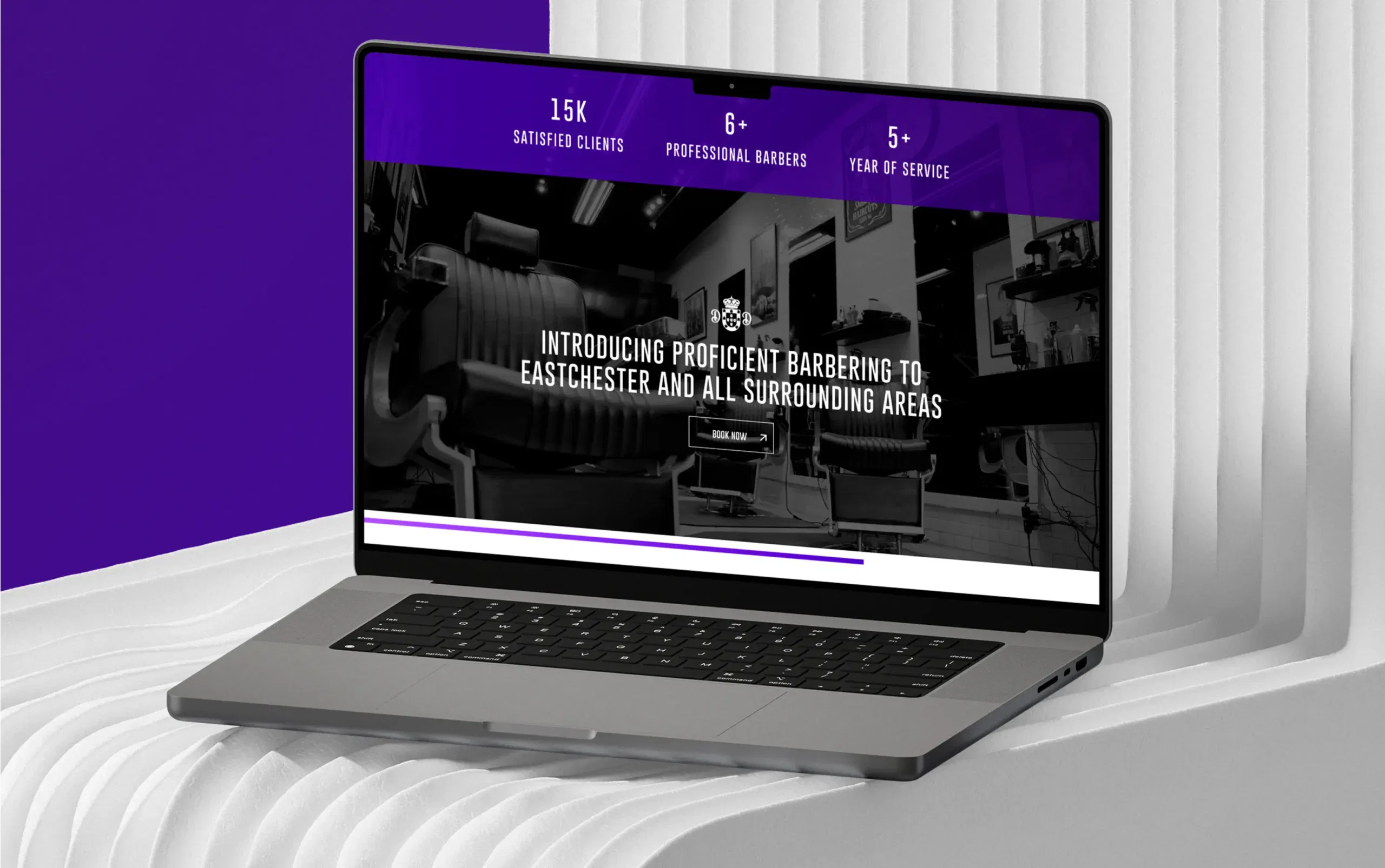 Laptop displaying a modern barber shop website with a sleek purple and black design.