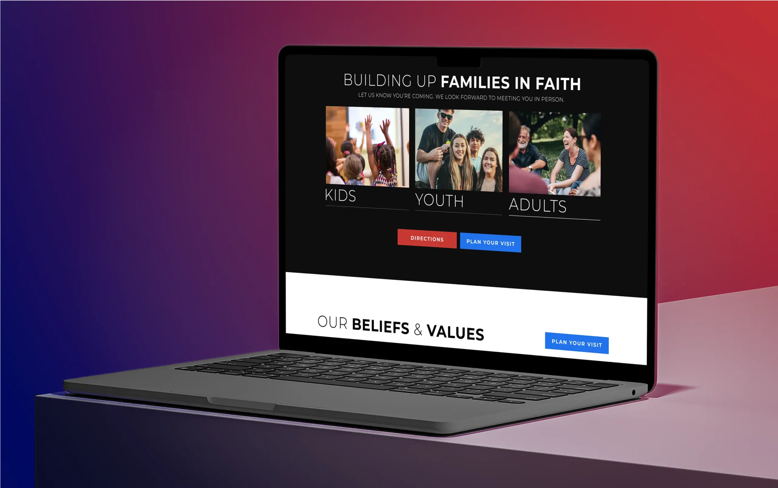Laptop displaying the homepage of a family-oriented faith community website against a colorful backdrop.