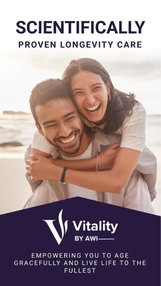 Happy couple embracing on the beach, promoting longevity care by Vitality.