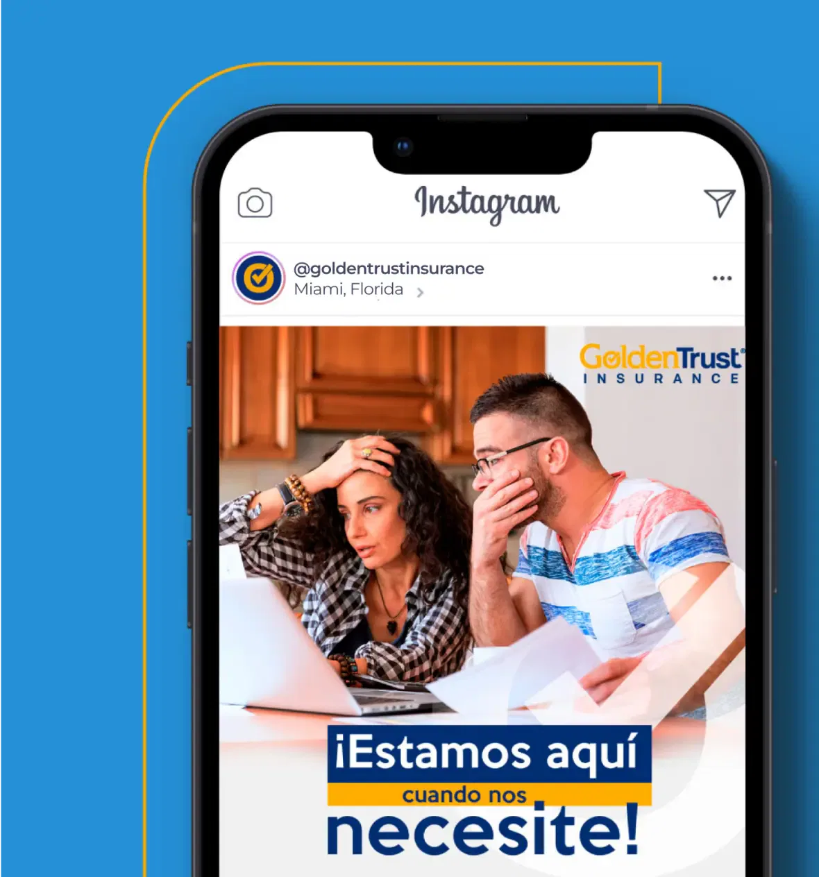 Couple reviewing documents with concern at a table, highlighted on a smartphone screen, promoting Golden Trust Insurance.