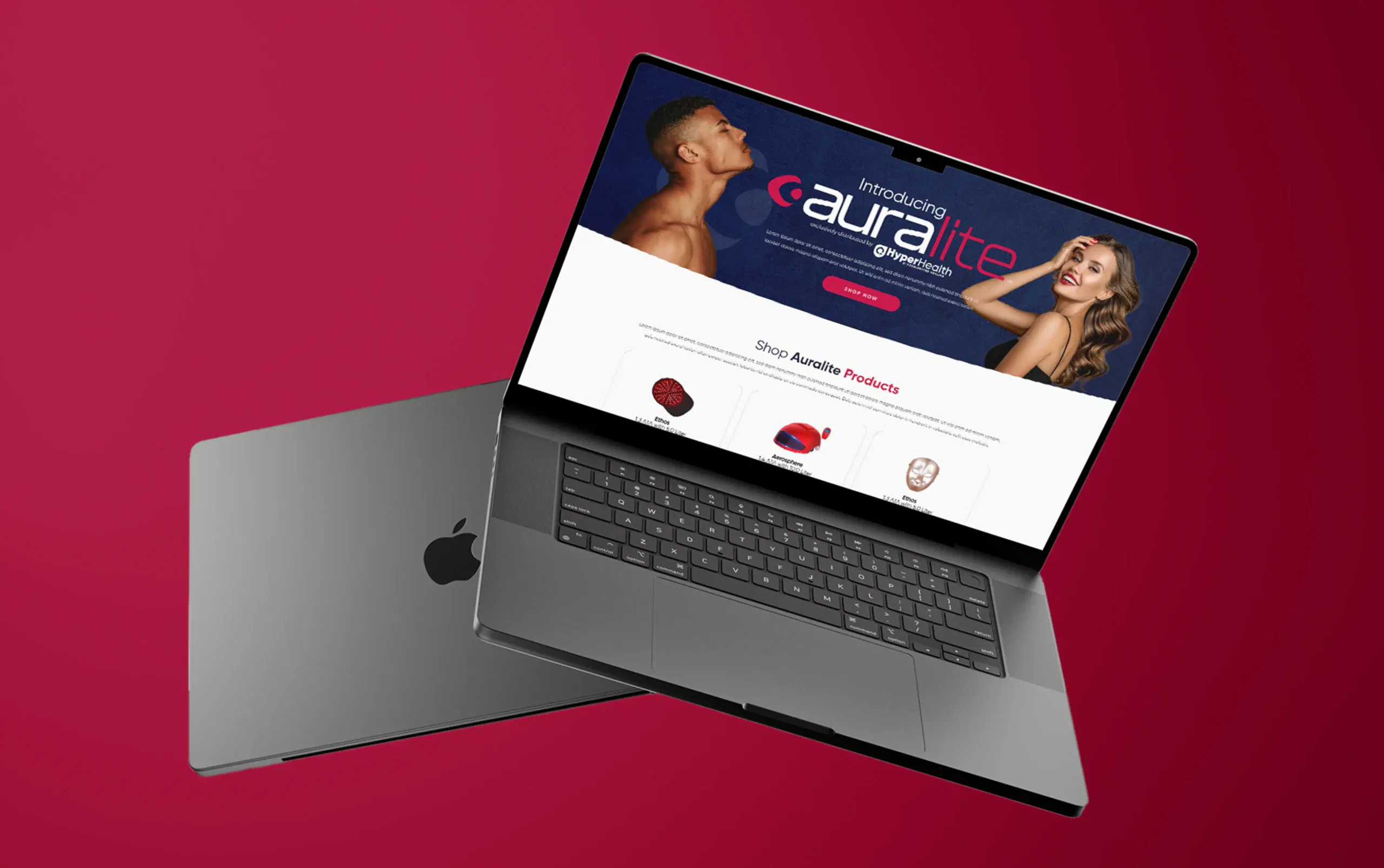 Sleek laptop displaying a vibrant website on a bold red background.