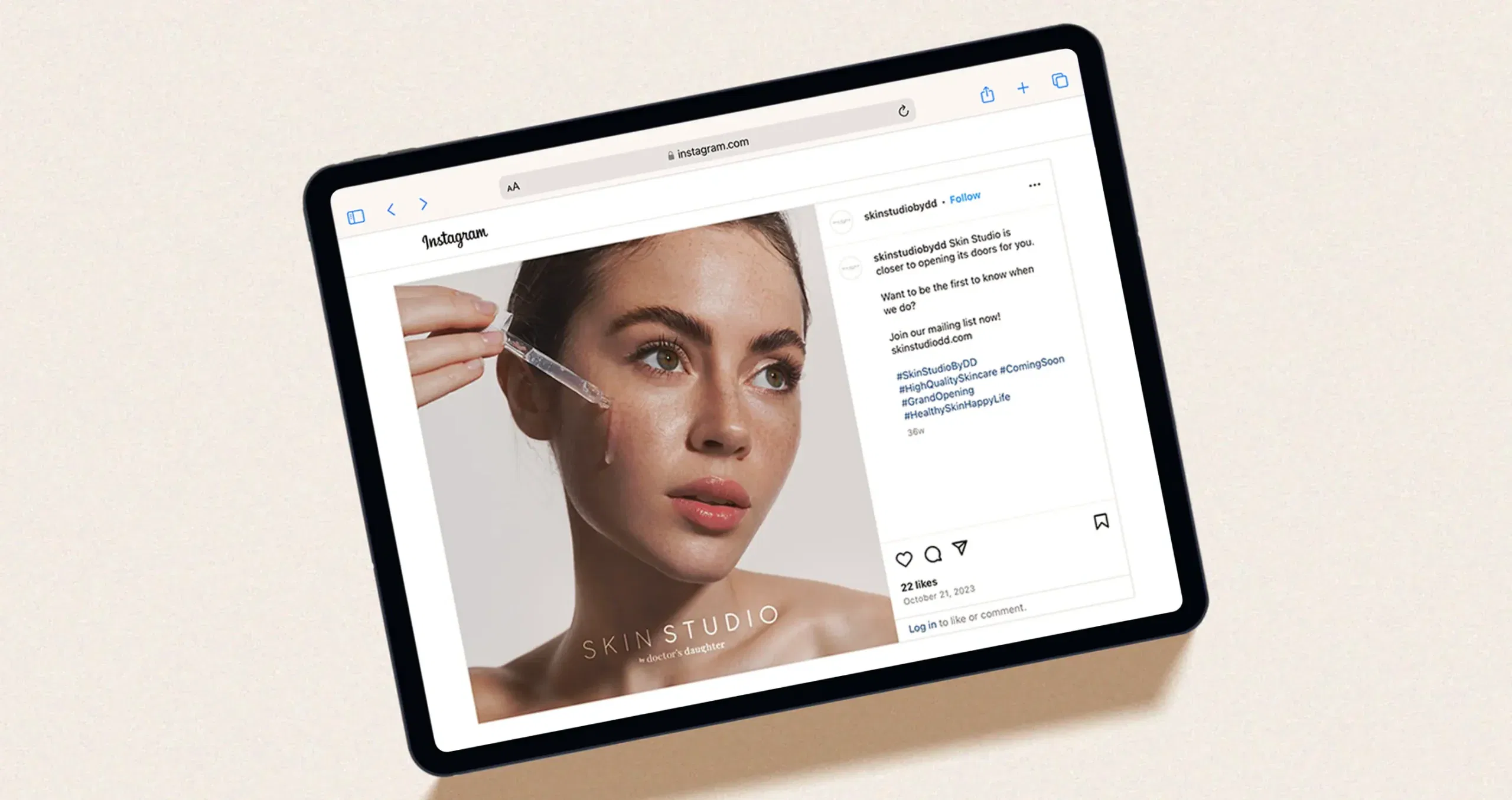 A tablet displaying an Instagram post featuring a woman applying skincare serum to her face.