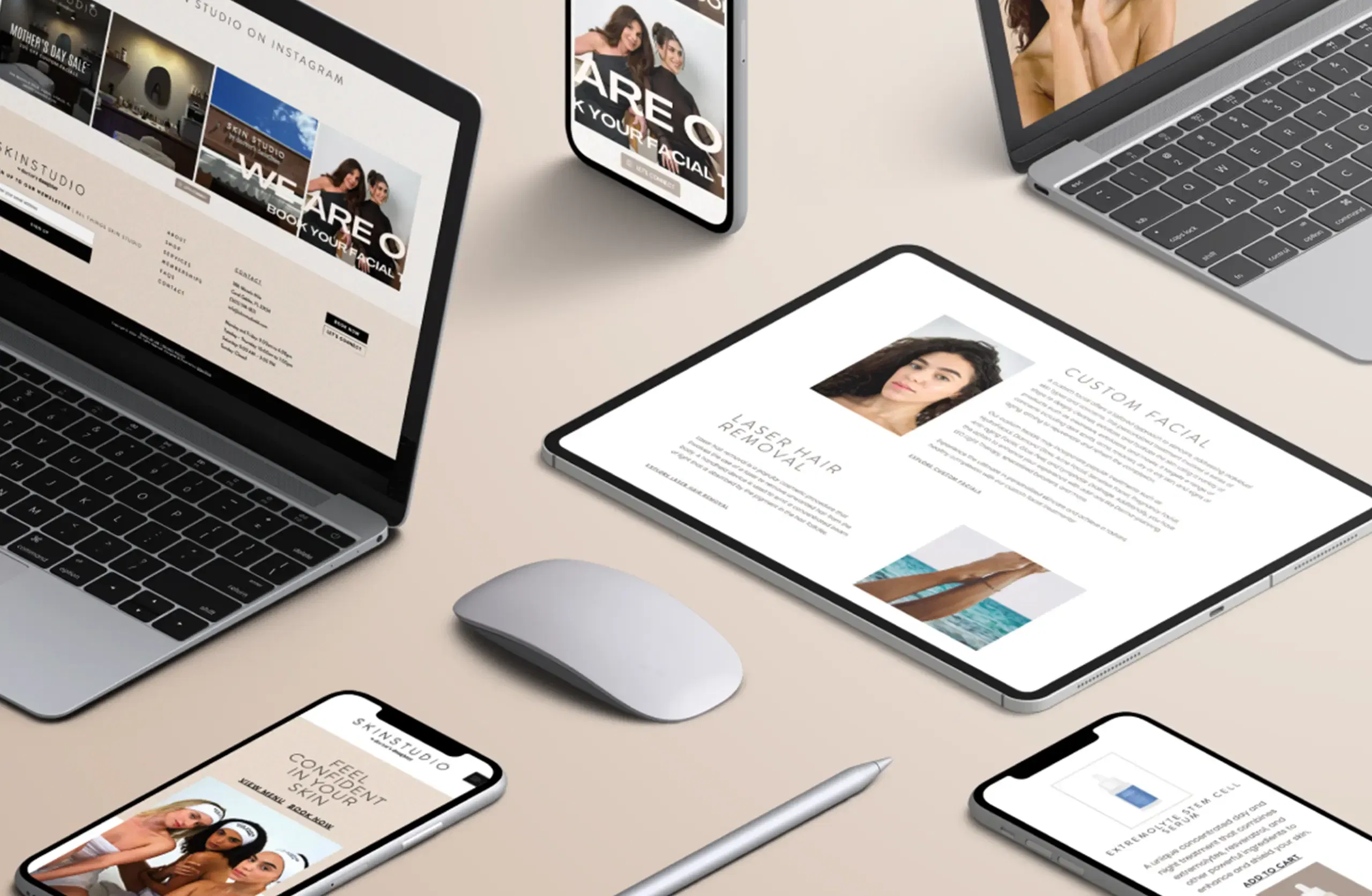 Multiple digital devices displaying modern website designs on a beige surface.