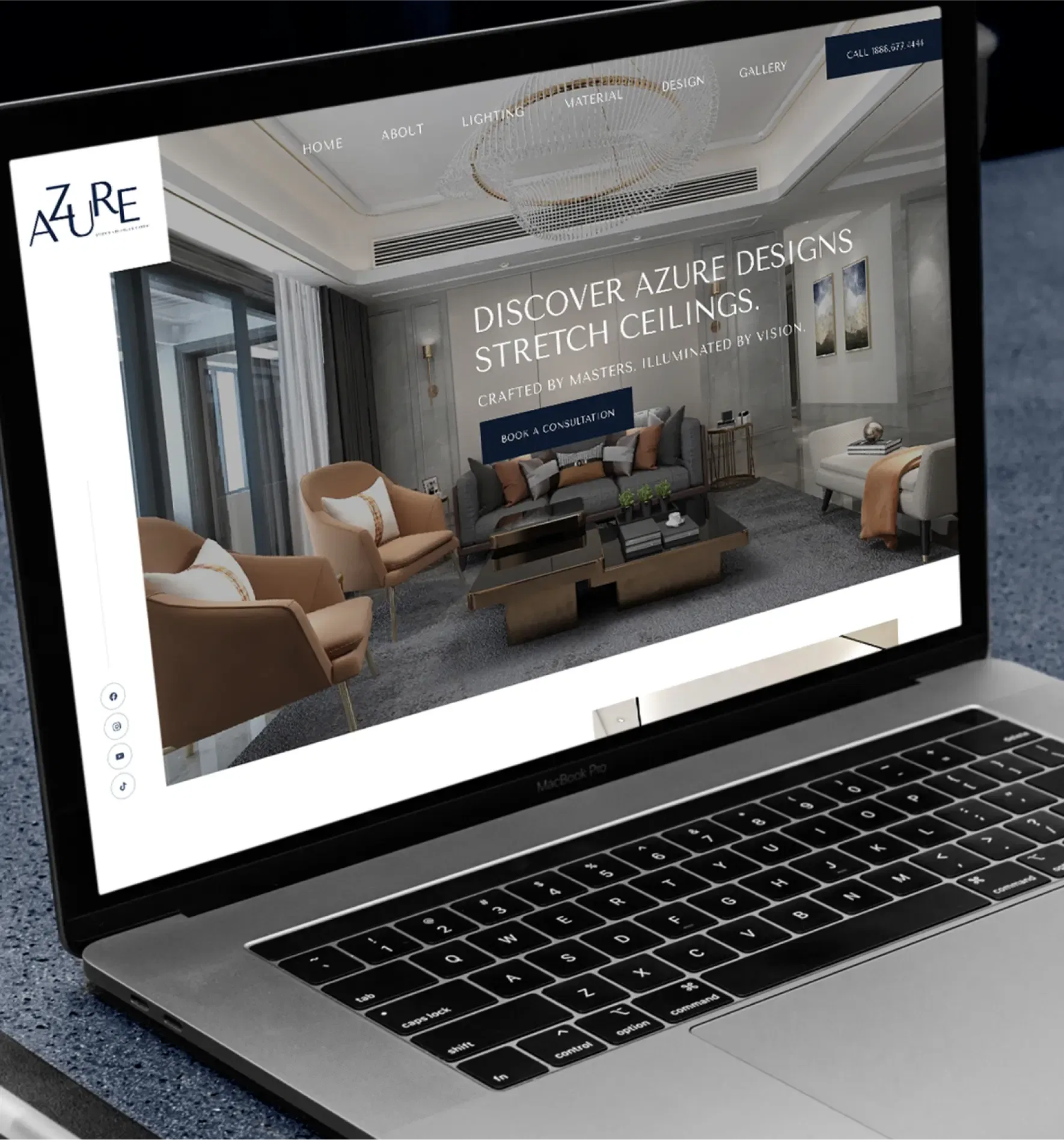 Laptop displaying a modern interior design website featuring stretch ceilings in an elegant living room setting.