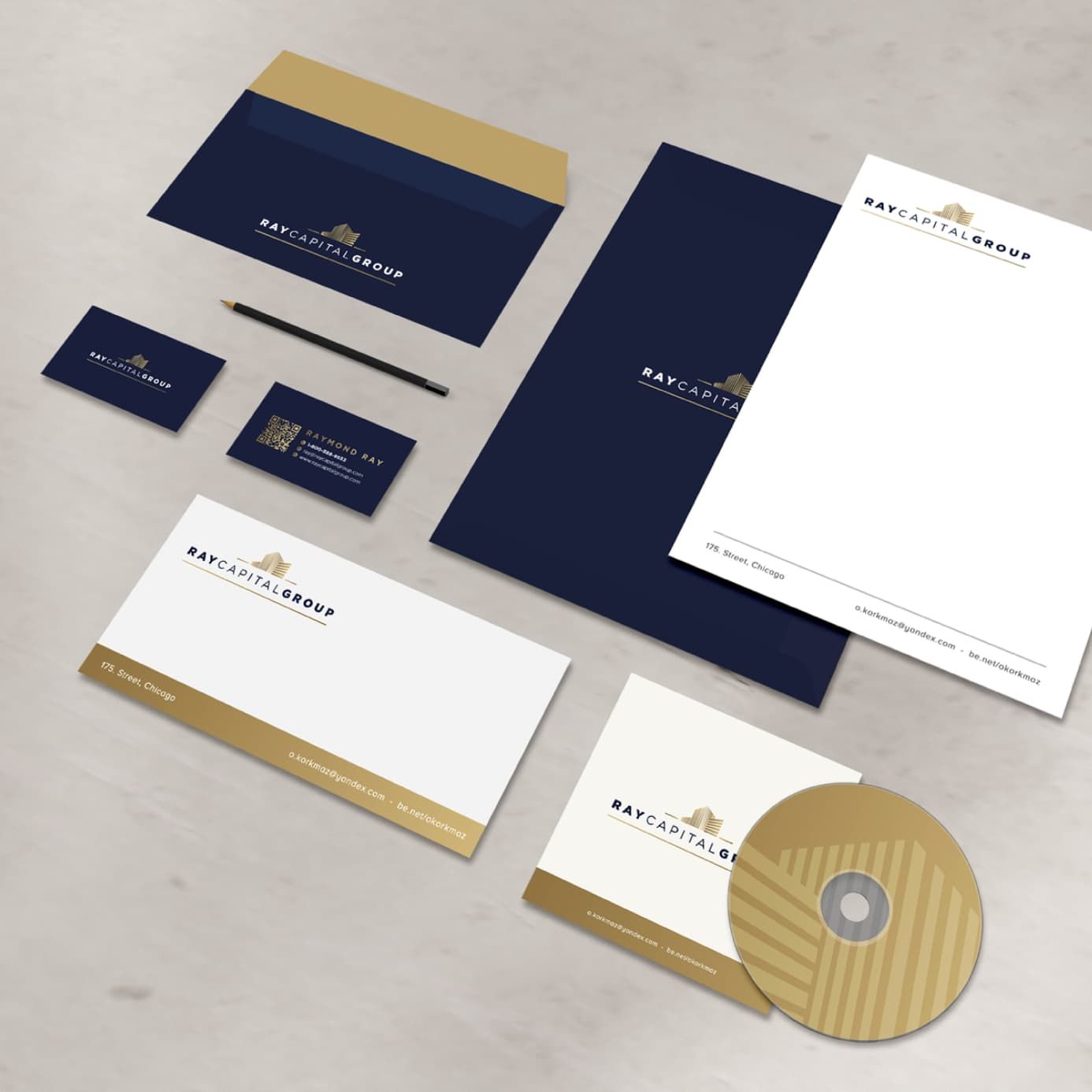 Professional branding materials featuring letterhead, business cards, envelope, and CD with a navy and gold theme.