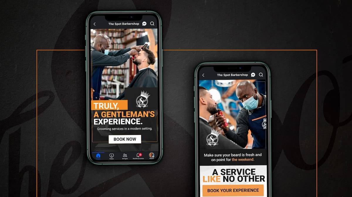 Barber giving a gentleman's haircut while customer enjoys the service on mobile screens.