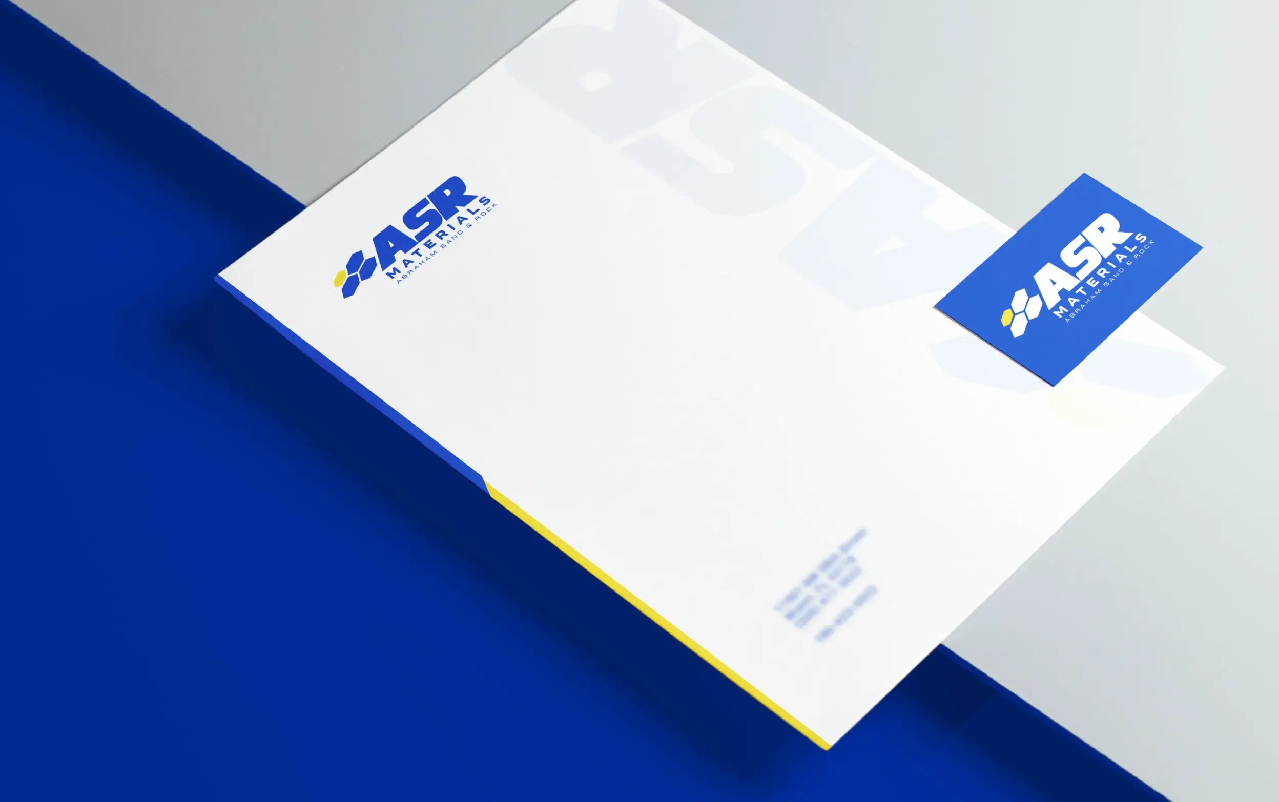 ASR company's sleek brochure design on a blue and gray background.