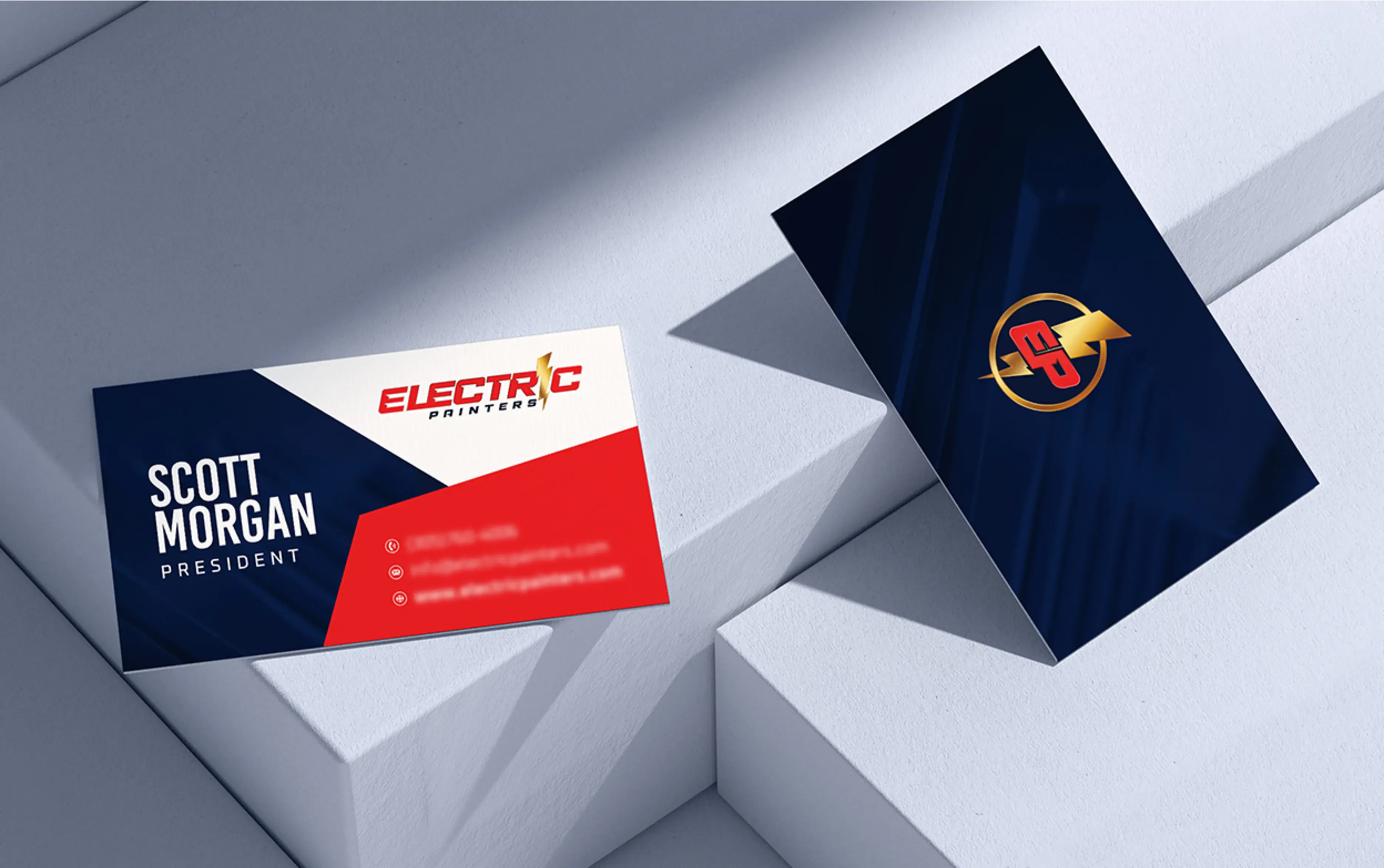 Two business cards on a minimalist surface, featuring Electric branding with bold colors and a sleek design.