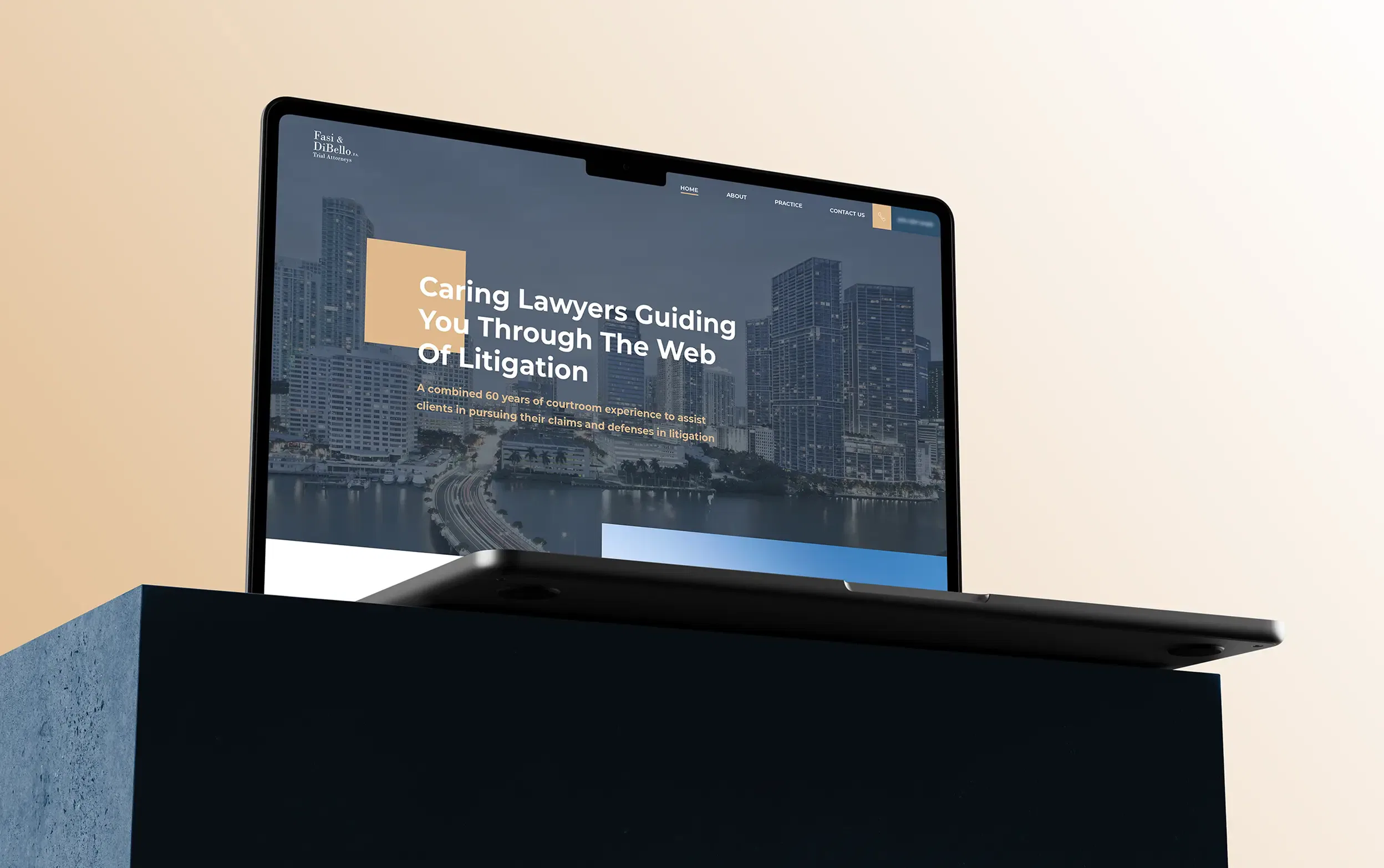 Laptop displaying a legal website against a light background.