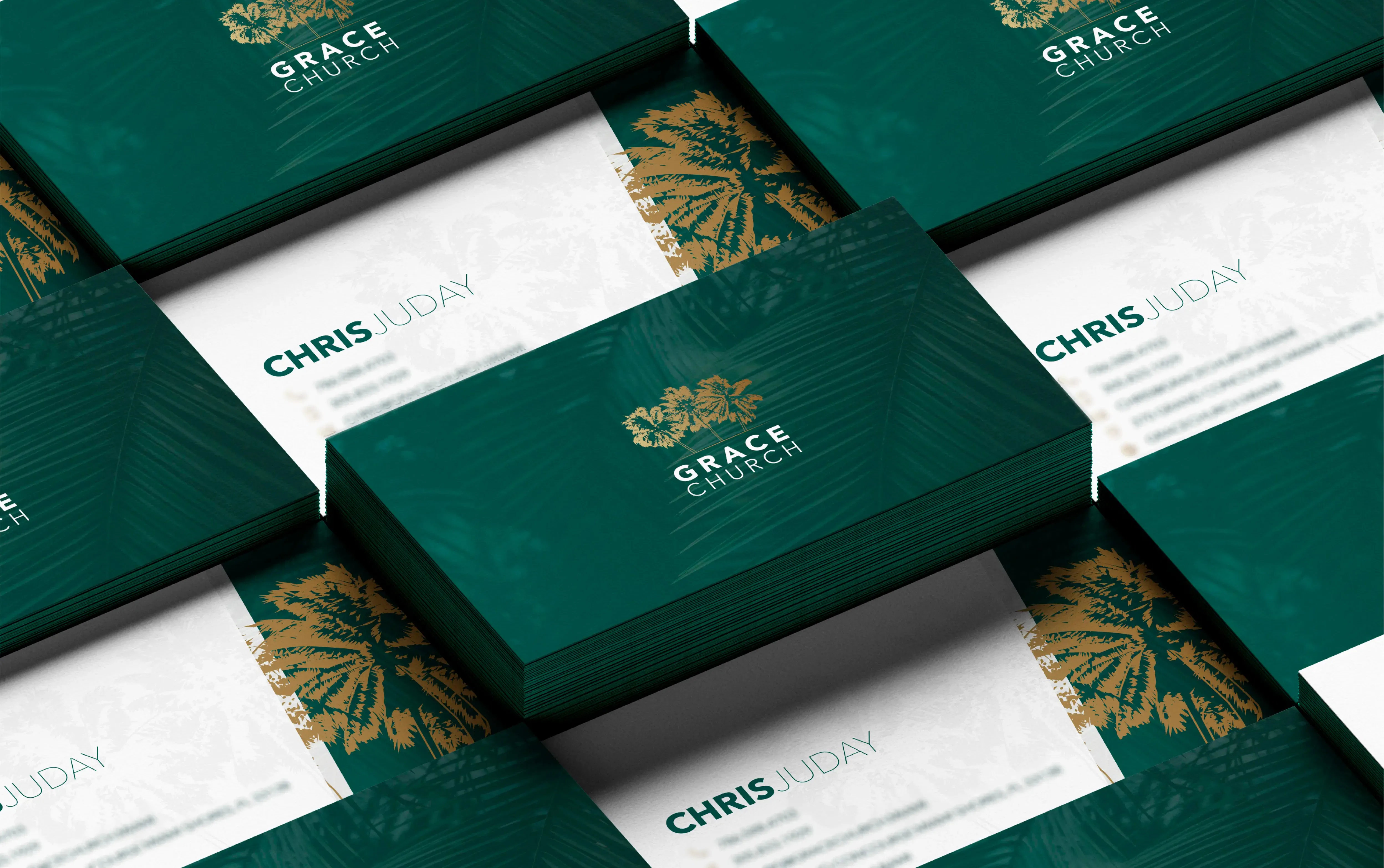Elegant business cards with green and gold design featuring the name Grace Dental Clinic.