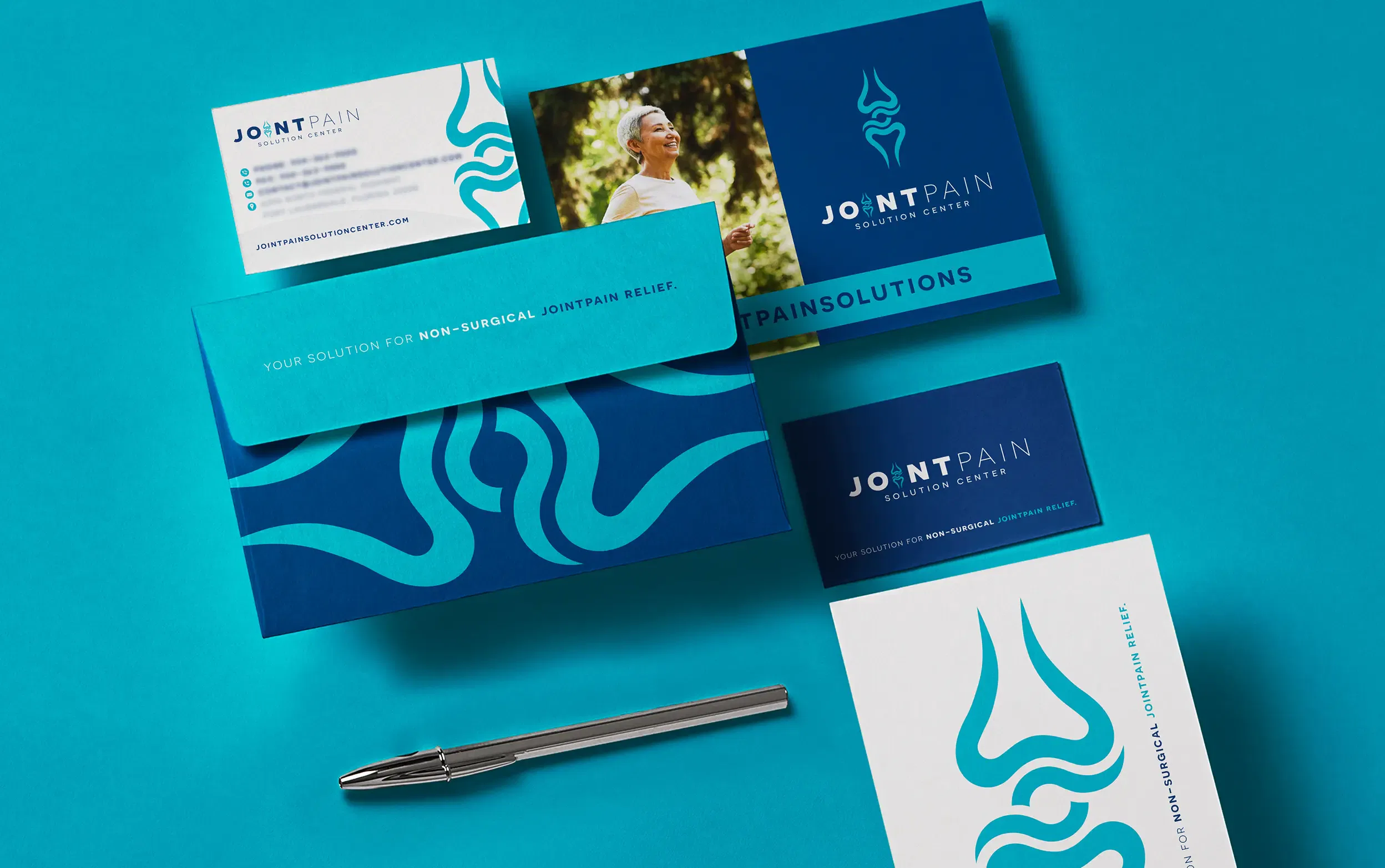 Sleek business stationery set featuring turquoise branding elements on a blue background.