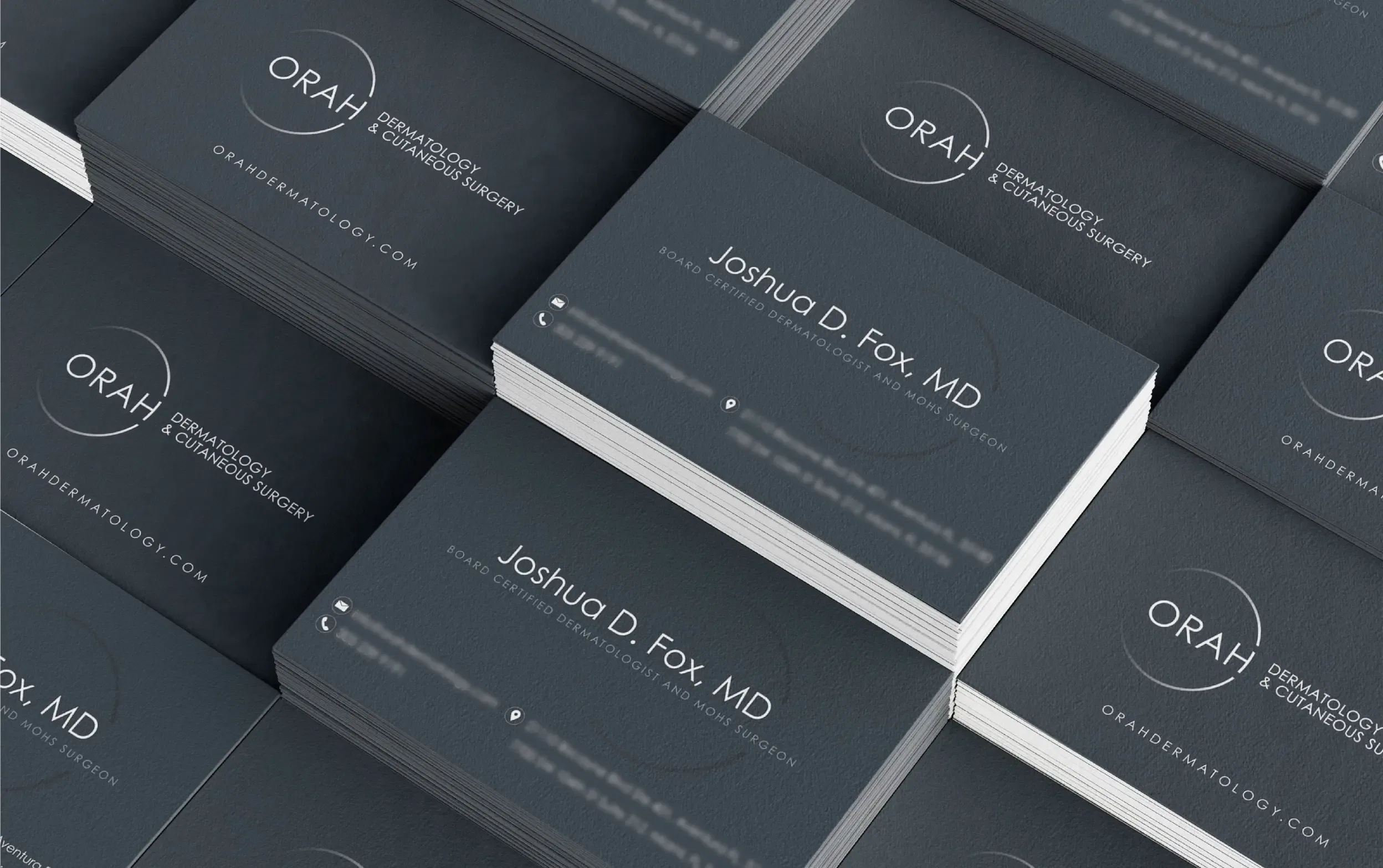 Stacked business cards for Dr. Joshua D. Fox, featuring a modern design with a black and white color scheme.
