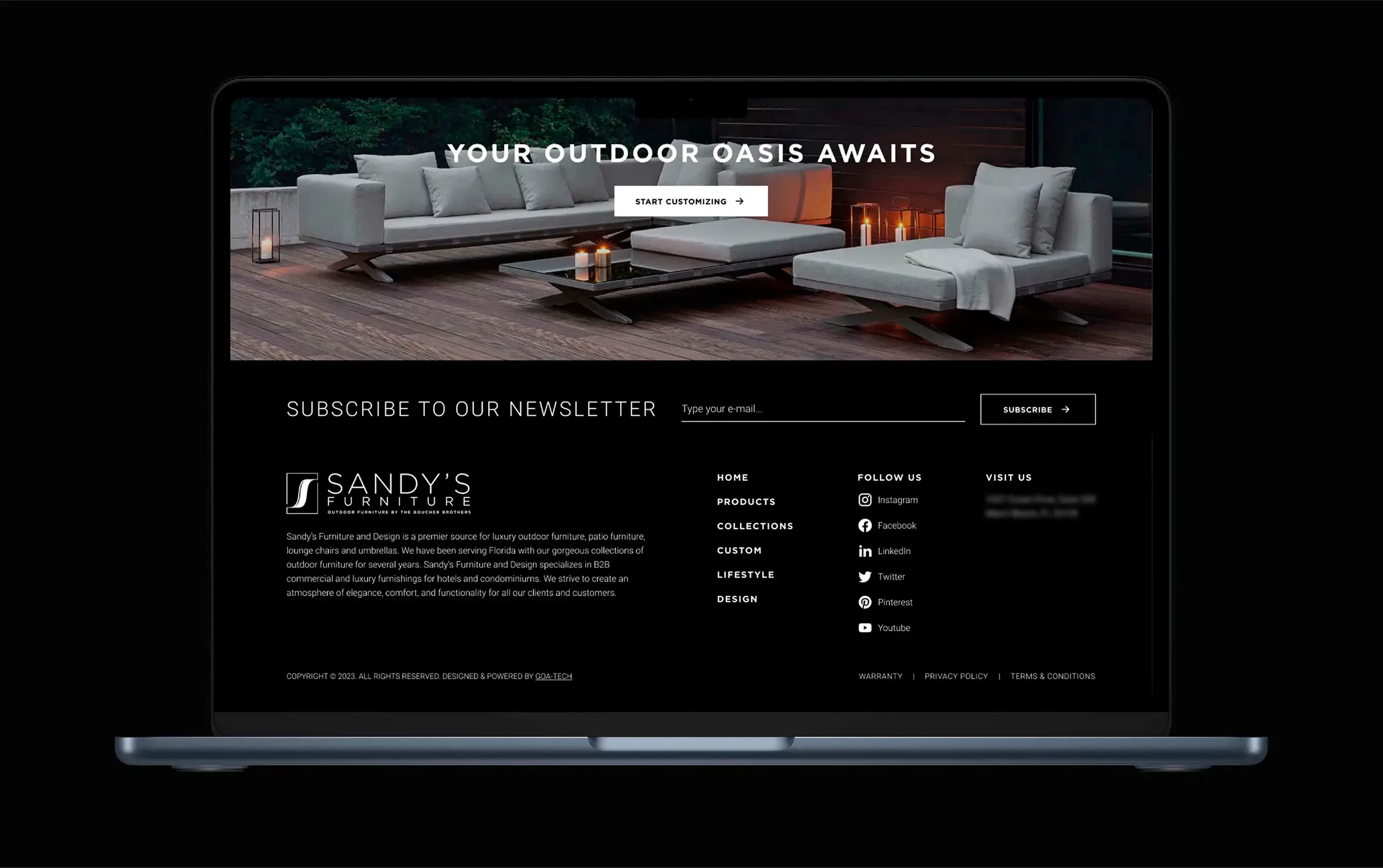 Laptop showing a stylish outdoor patio furniture setup with a modern design theme.