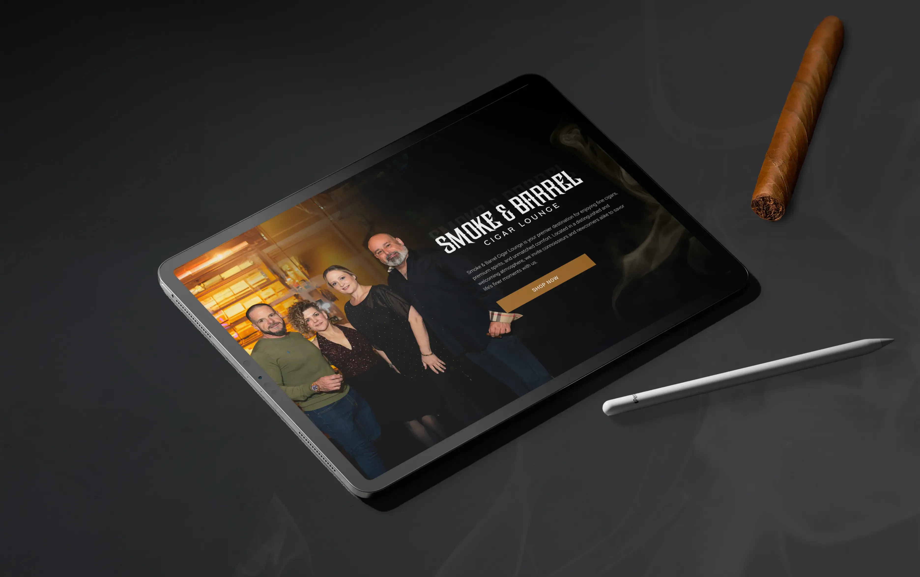 Digital tablet displaying a smoke and barrel whiskey website with a cigar and stylus on a dark table.