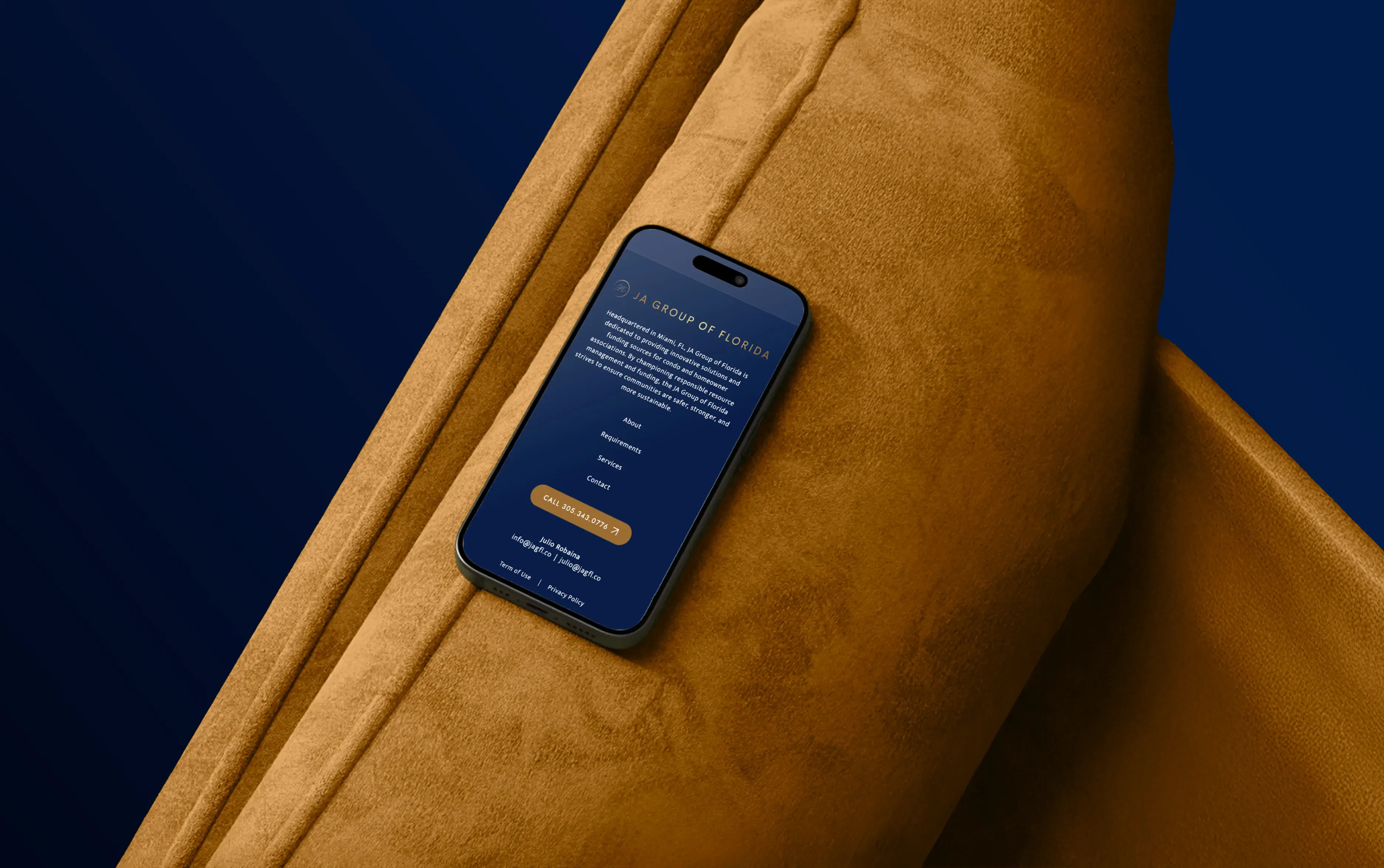 Smartphone resting on a plush brown couch displaying a blue screen with text.