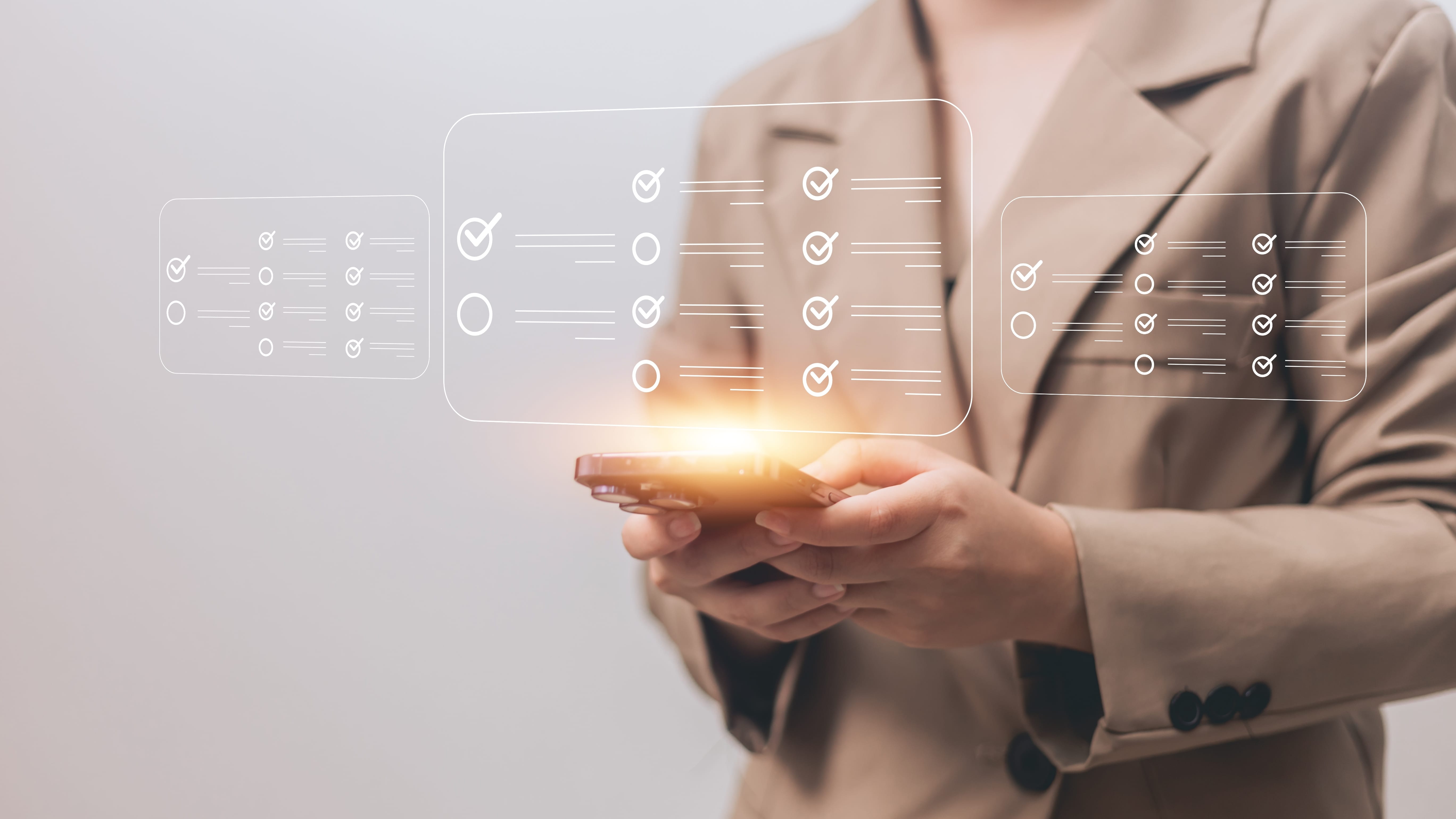Woman holding glowing digital checklist icons